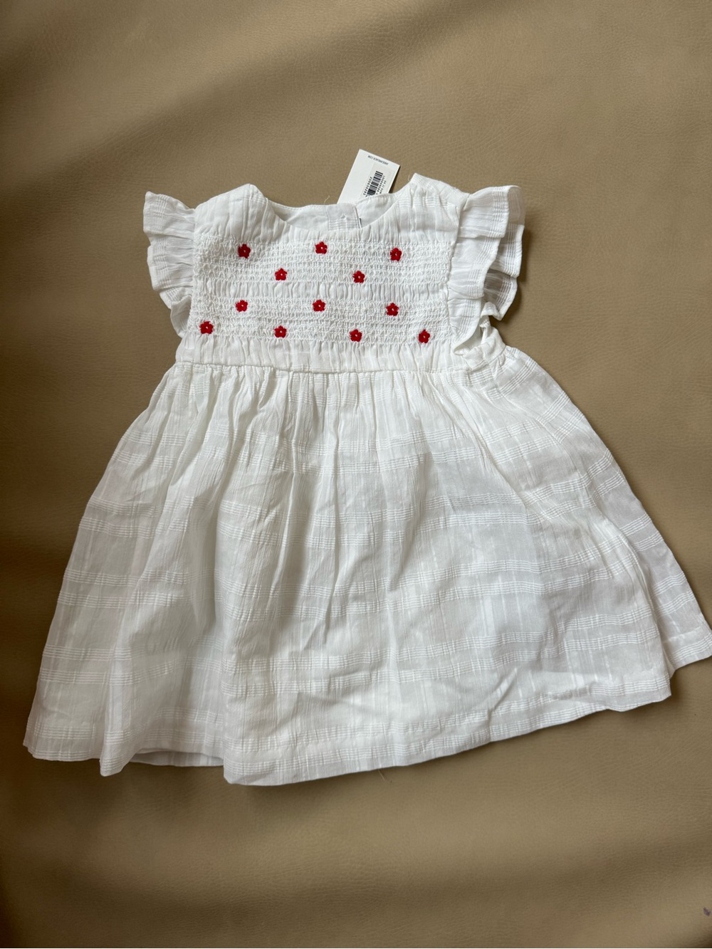 White Smocked Flutter-Sleeve Kids Dress with Red Floral Detail
